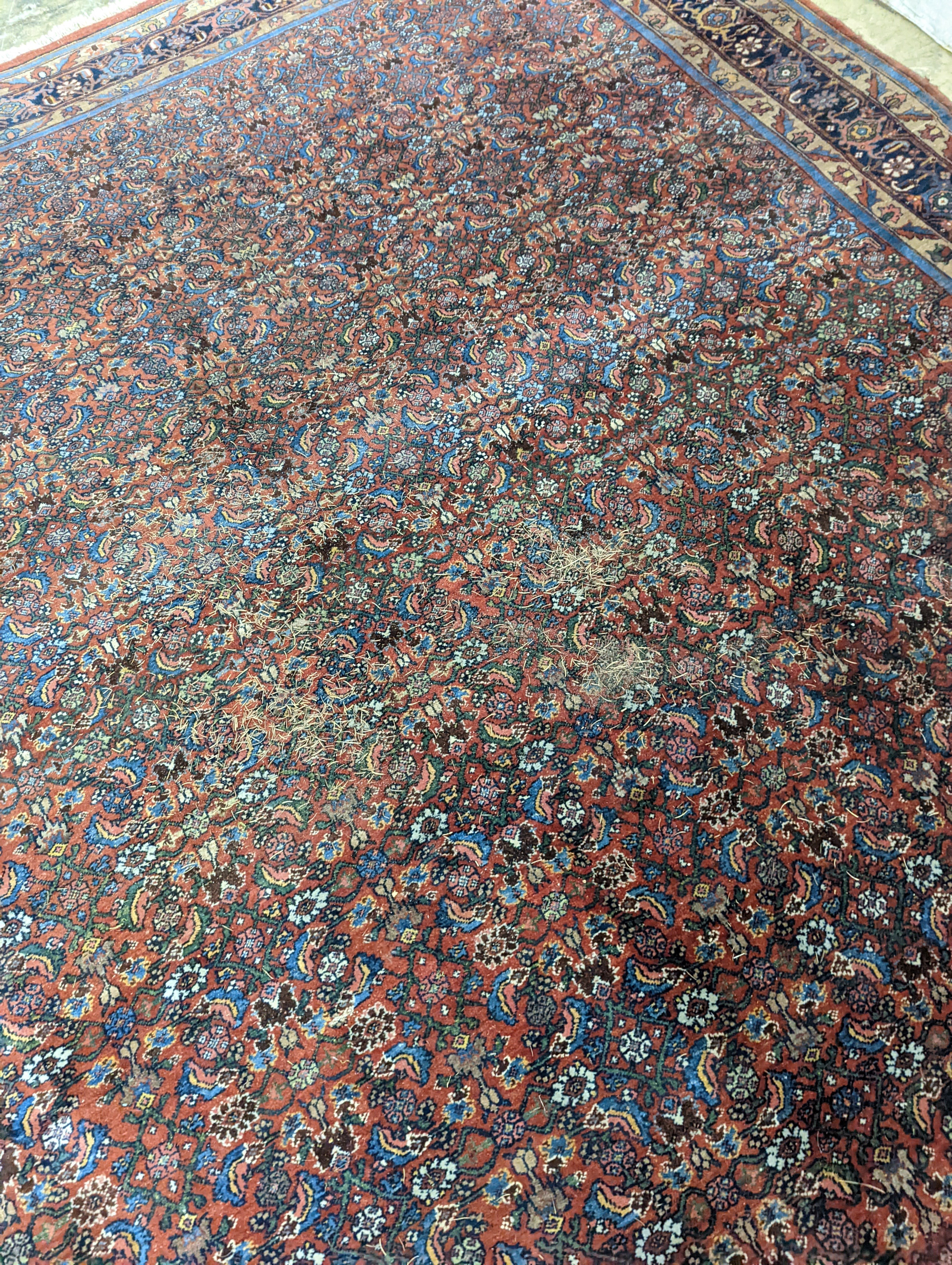 A North West Persian red ground carpet, 360 x 250cm